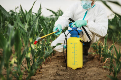 industrial-agriculture-theme-man-spraying-toxic-pesticides